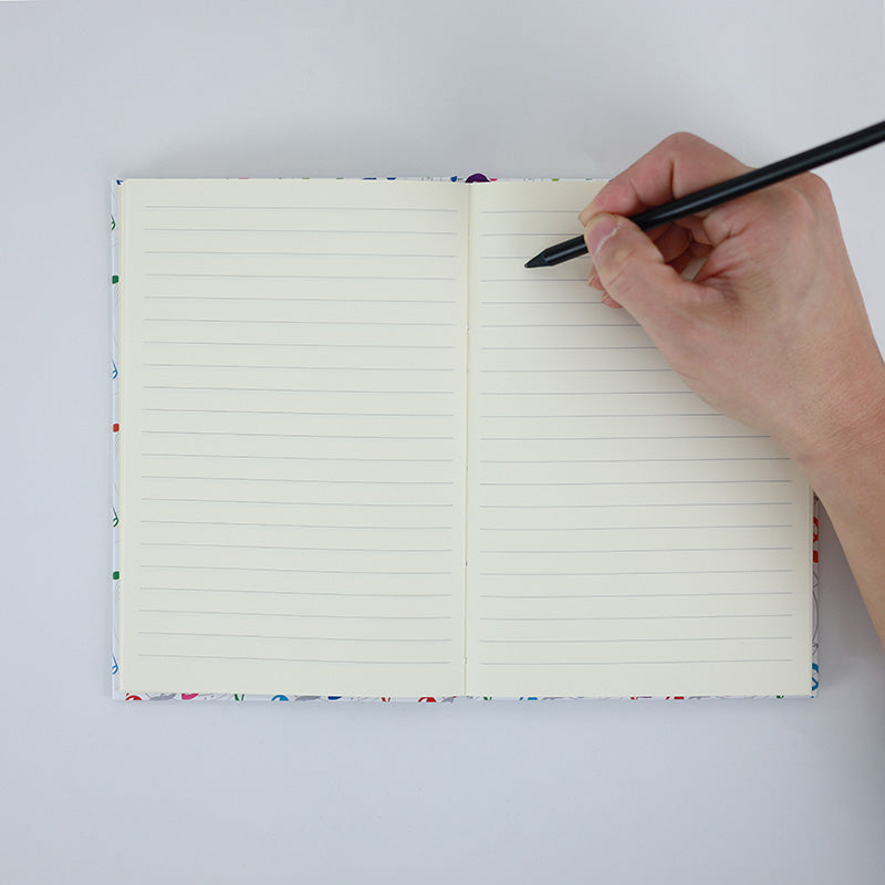 A5 Notebook with Colourful Music Treble Clefs